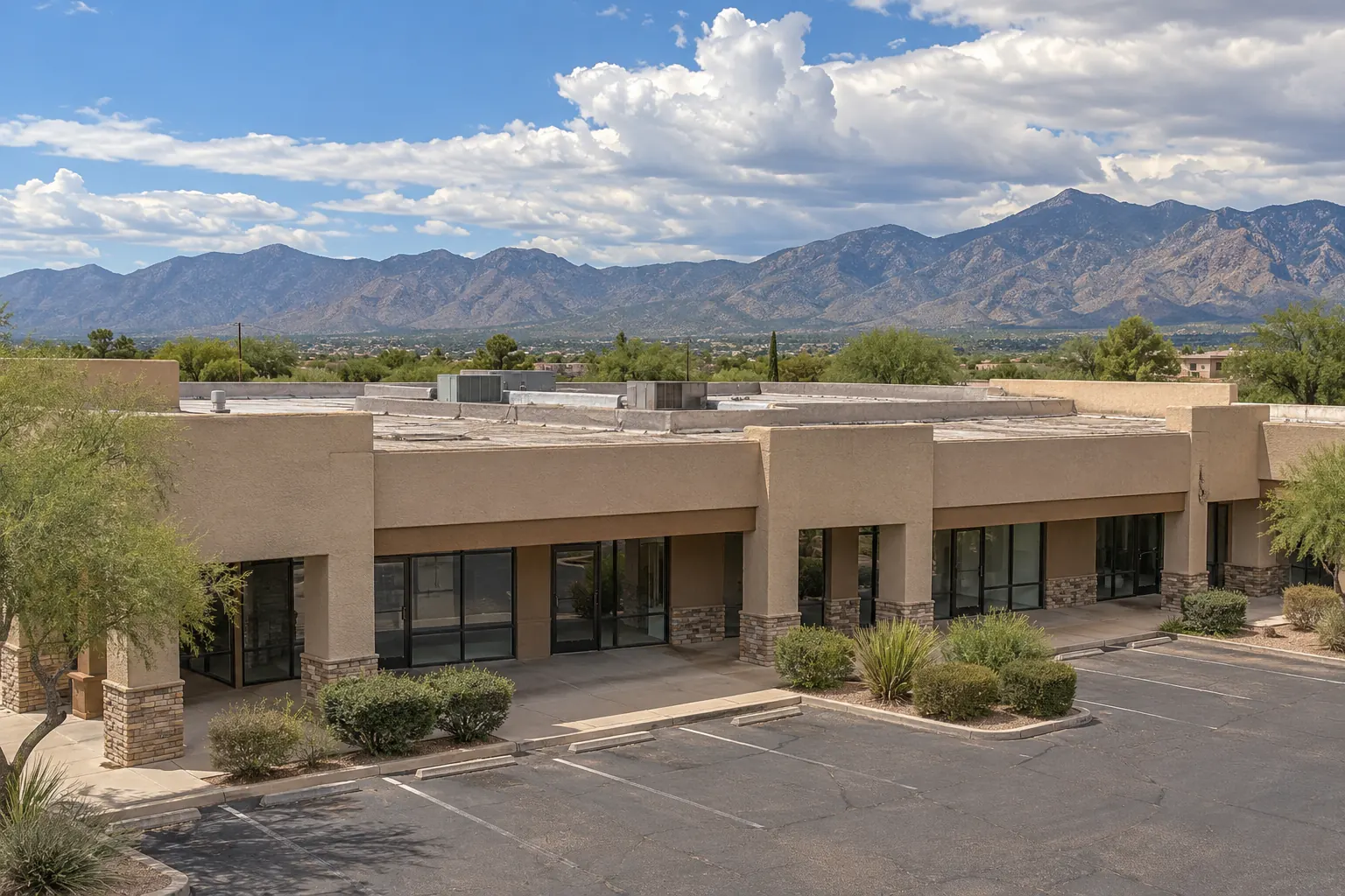 Single-story stucco retail center with flat roofs and rooftop units